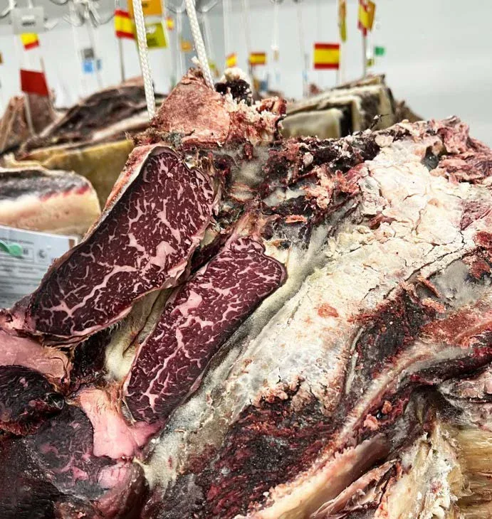 Open aged beef cut showing the outer crust and visible marbling