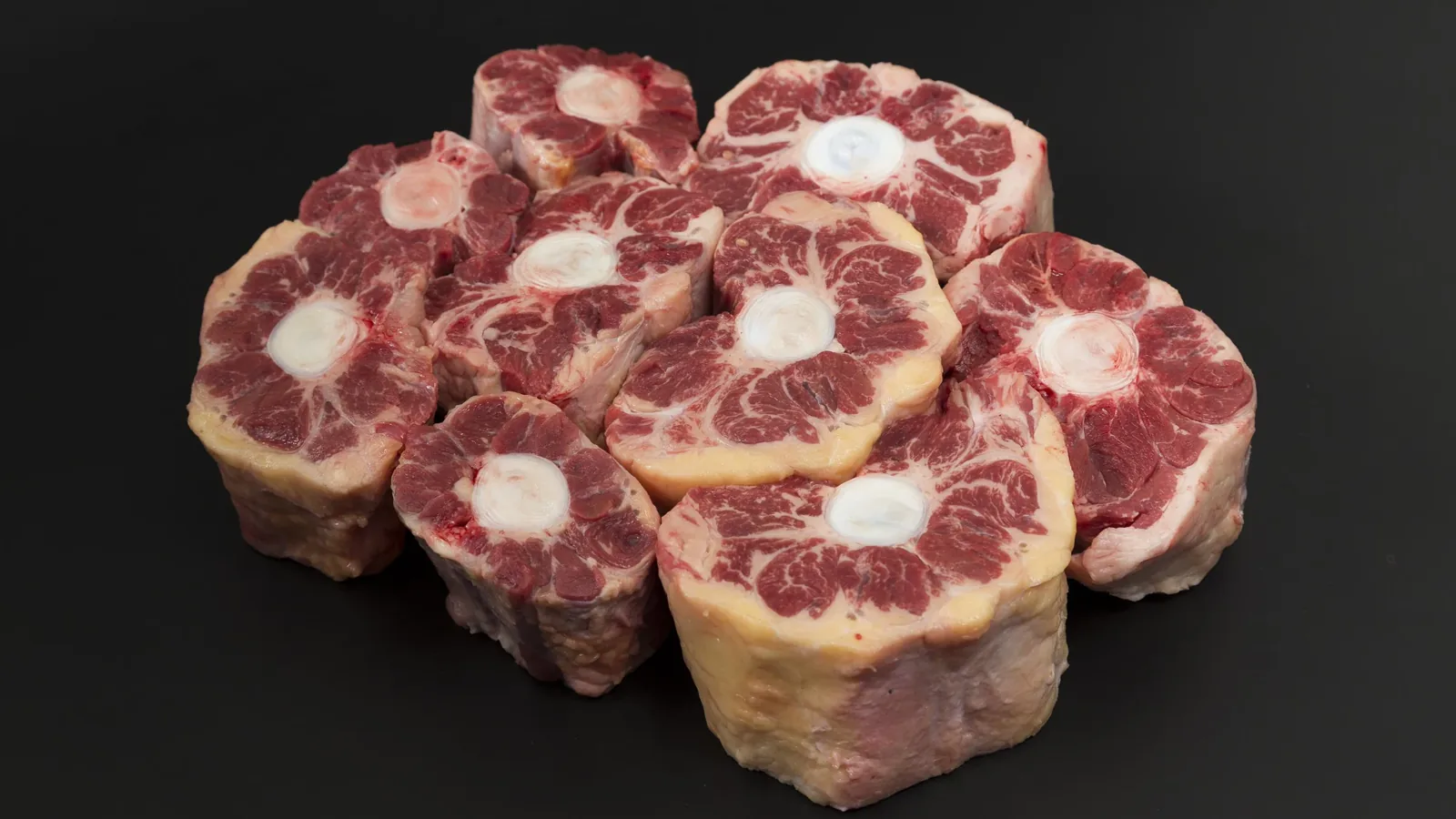 Uncooked shin medallions with the central bone visible